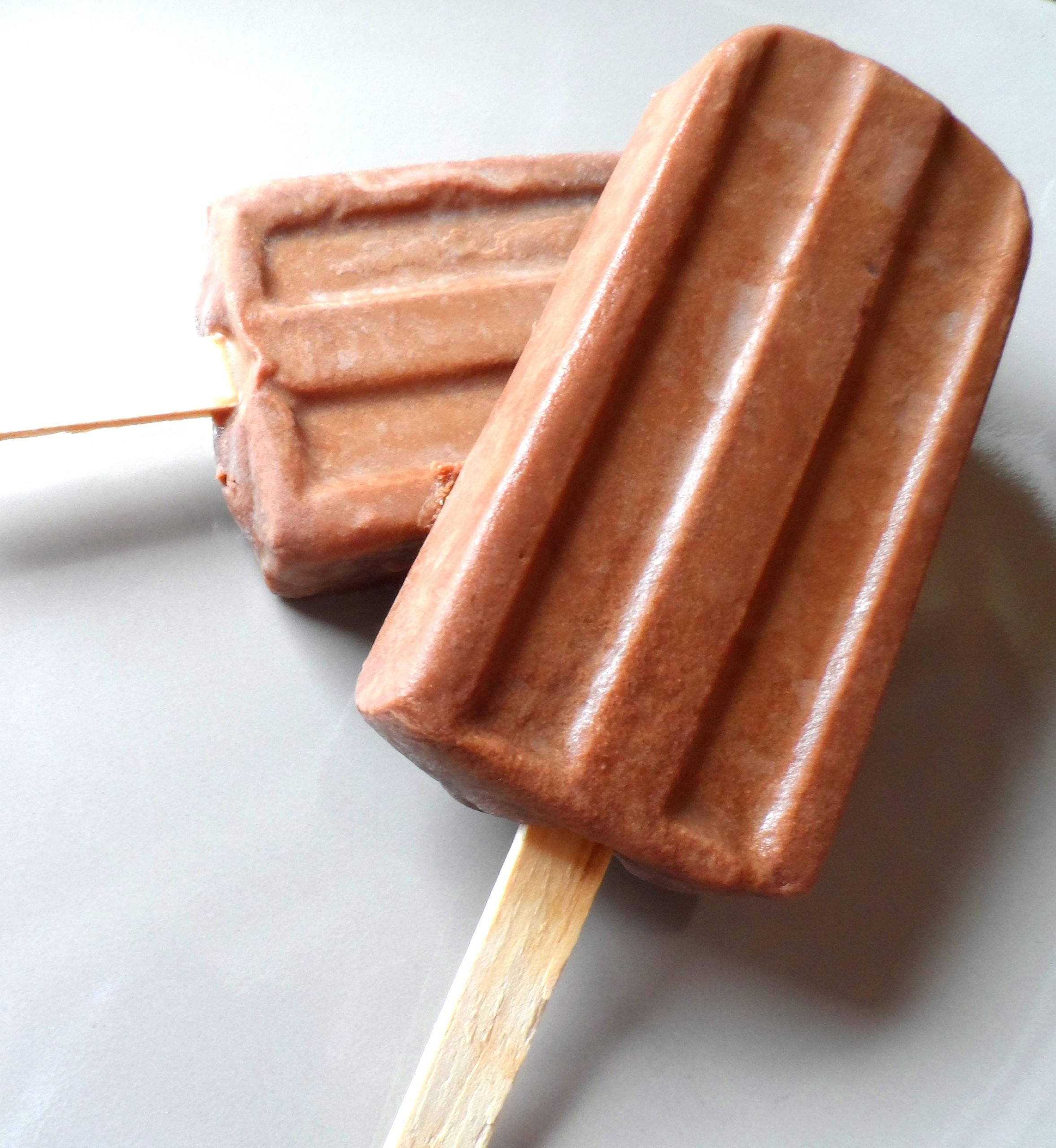 Two chocolate pudding popsicles